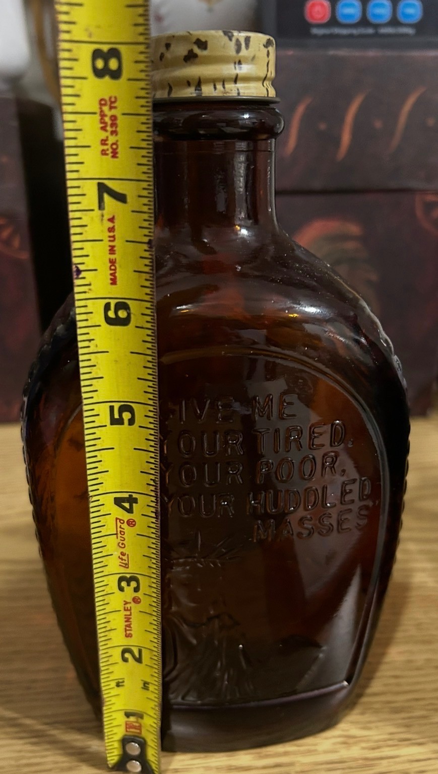 Vintage Brown amber bottle has the Statue of Liberty