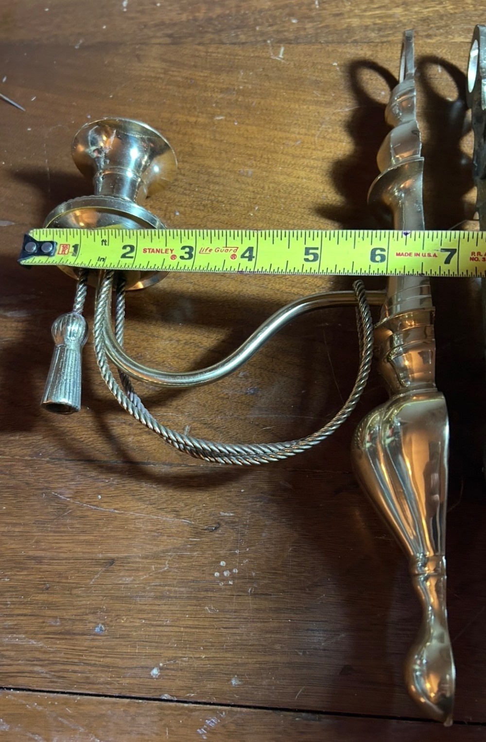 Vintage pair of brass wall sconces with rope and tassel detail