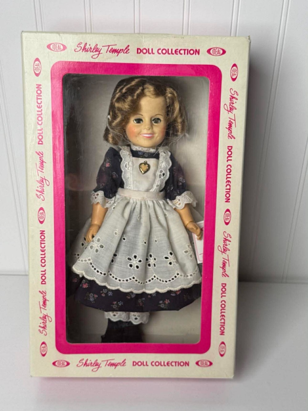 2625 -  1982 Shirley Temple doll by Ideal is part of a collector's set, featuring a dress inspired by the movie 