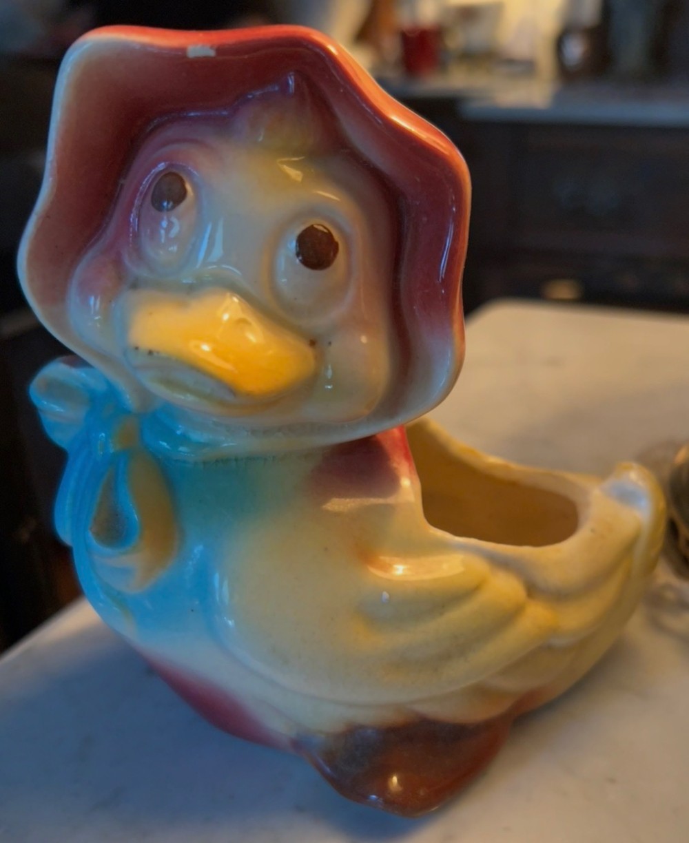 Vintage duck planter with red bonnet and blue bow