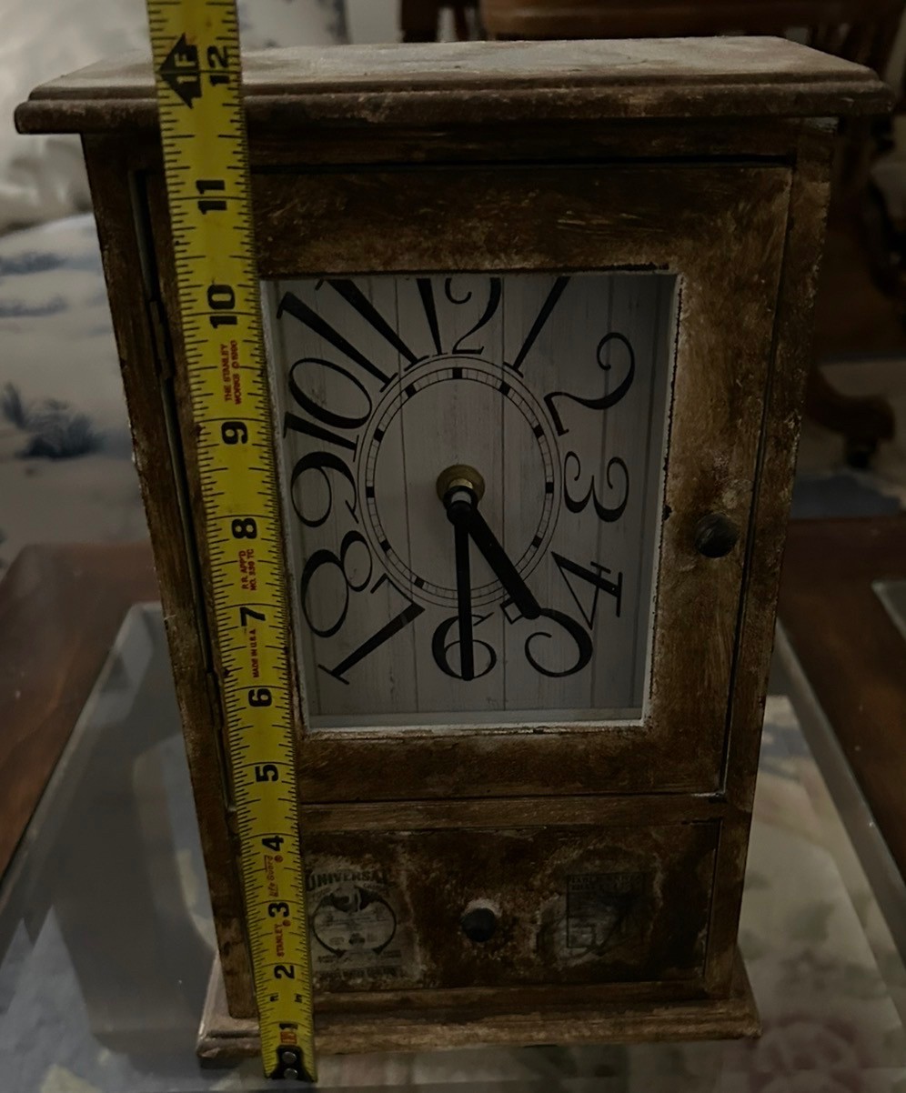Rustic brown clock with a drawer at the bottom