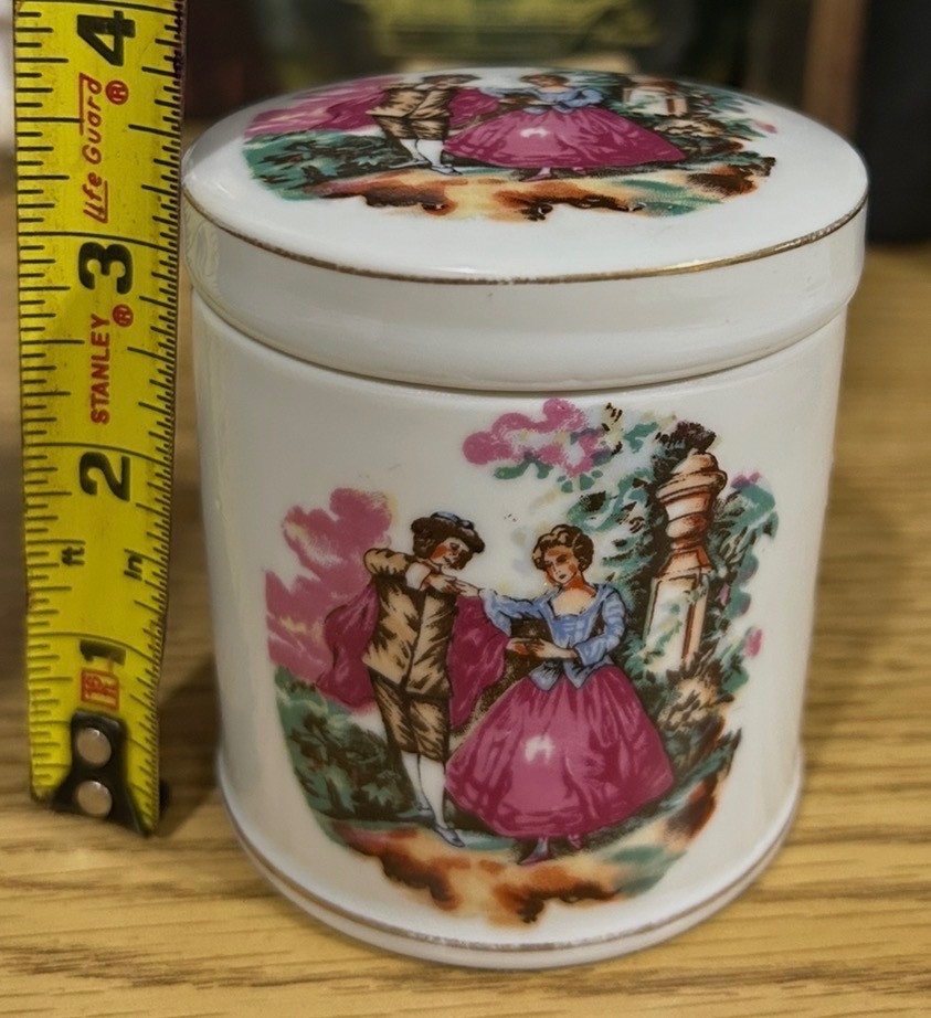 Vintage porcelain jar or cup featuring courting couple scene