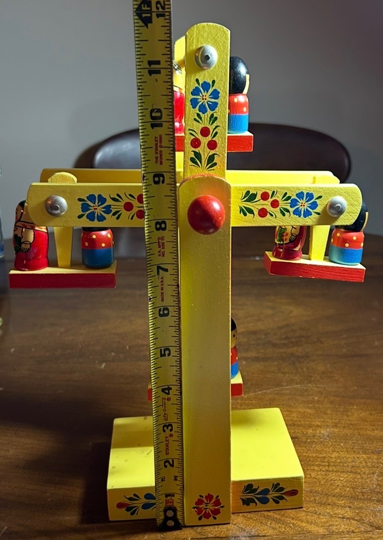 A vintage hand-painted  wooden Matryoshka doll Ferris wheel