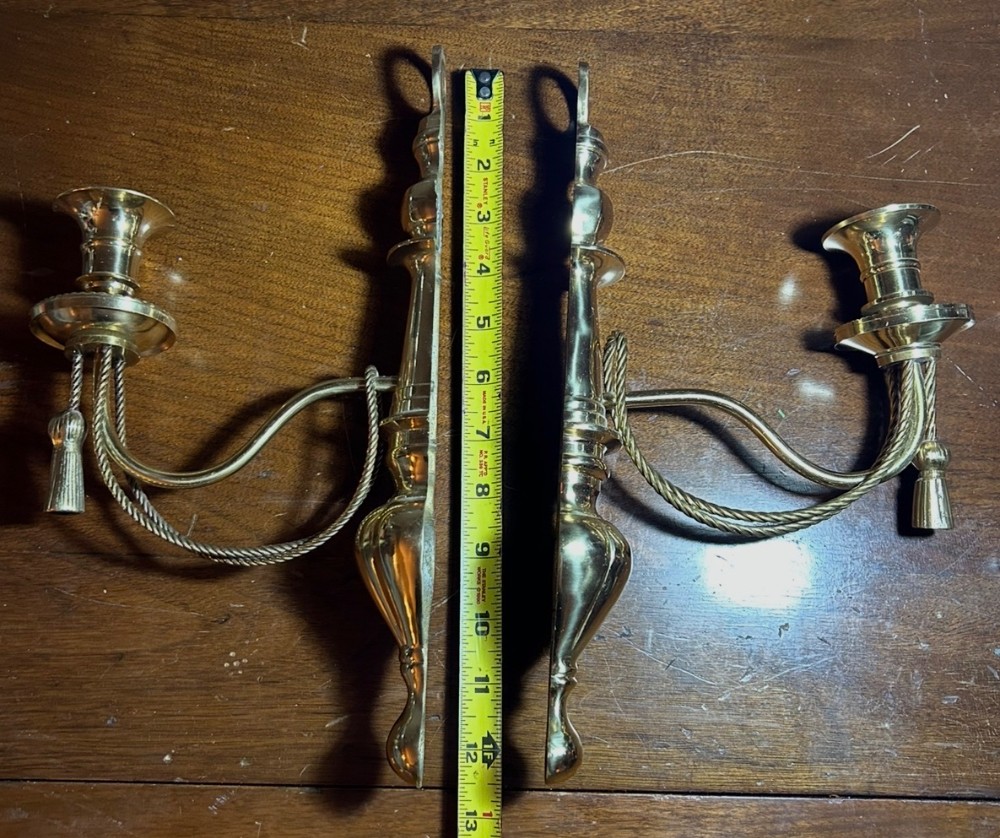 Vintage pair of brass wall sconces with rope and tassel detail