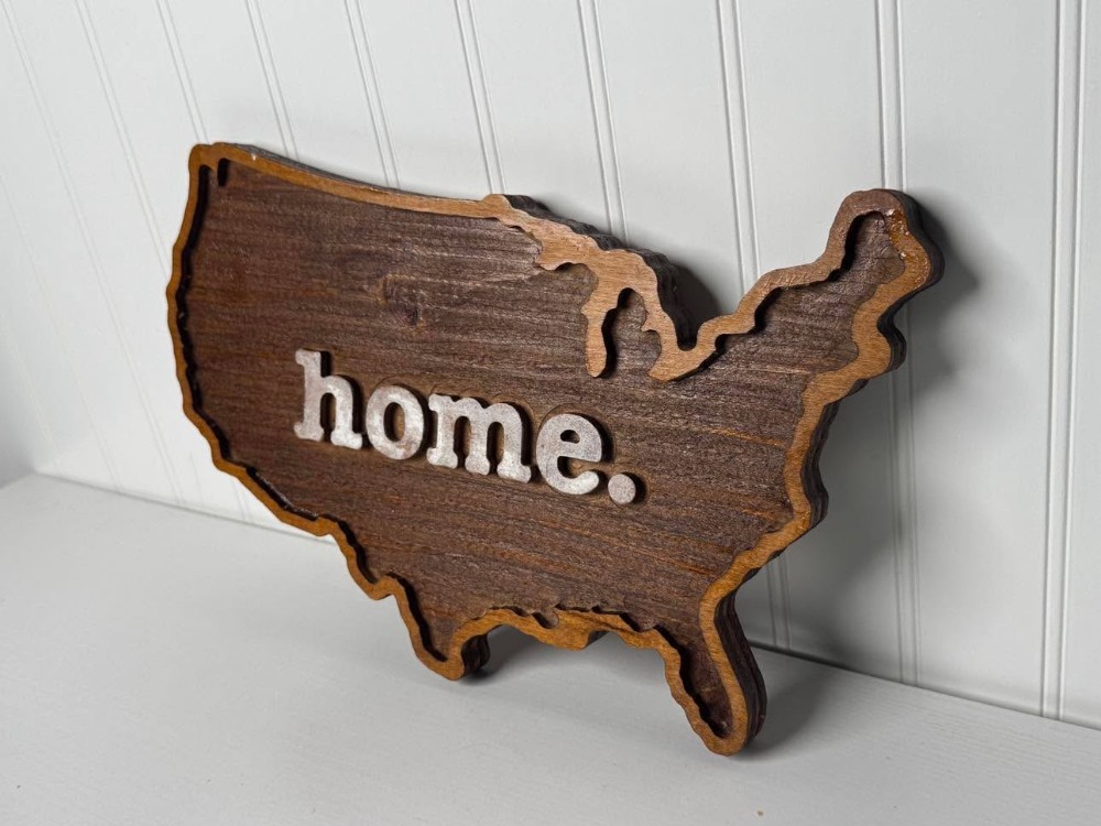 2605 - Layered wooden design shaped like the United States of America with the word 