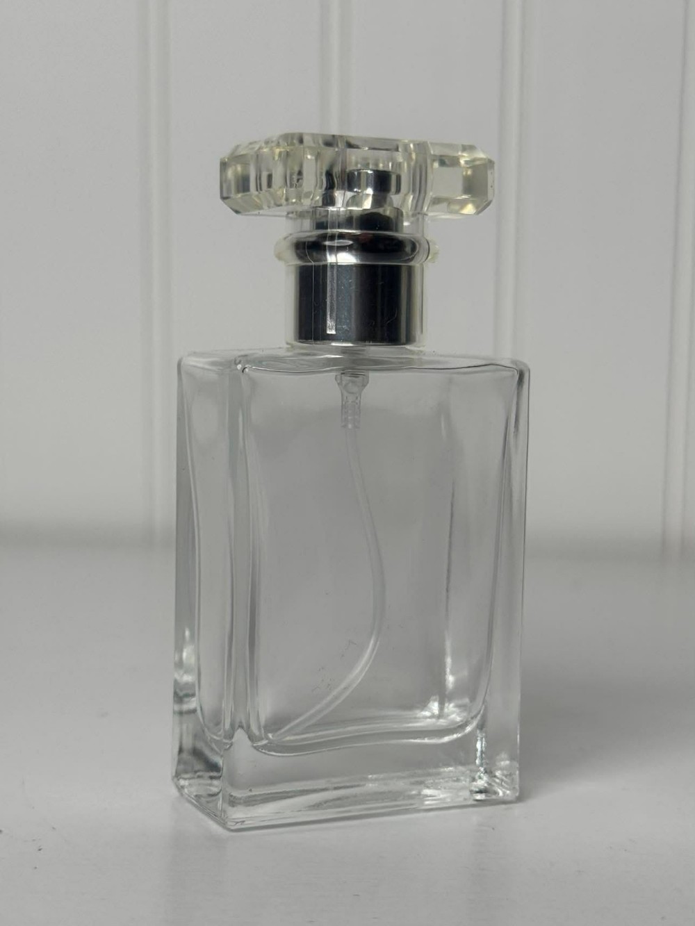 2546 - Clear, rectangular empty glass spray bottle designed for perfume or cosmetics (2x1x4)