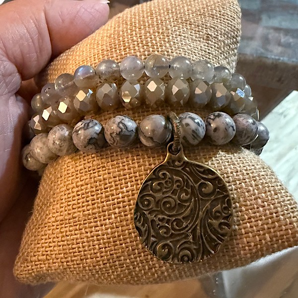 Three bracelet stretch set: gray tones w/bronze scroll medallion. This listing is for 3 separate bracelets sold Together as a set