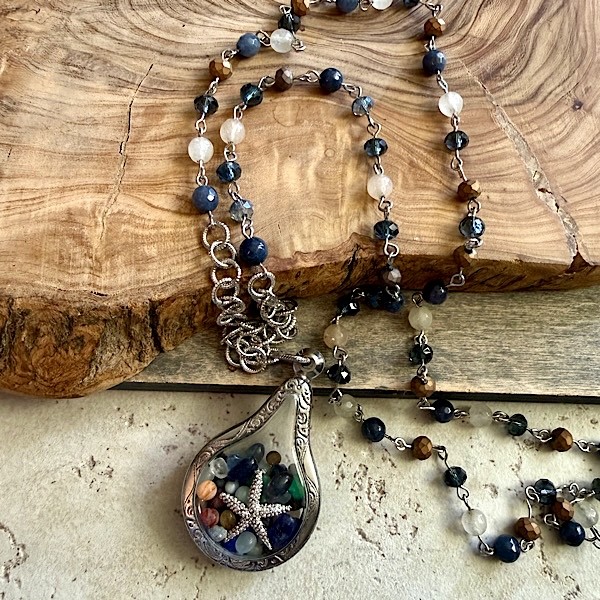 Memory pendant in silvertone w/starfish & glass beads on long mixed stone/crystal chain