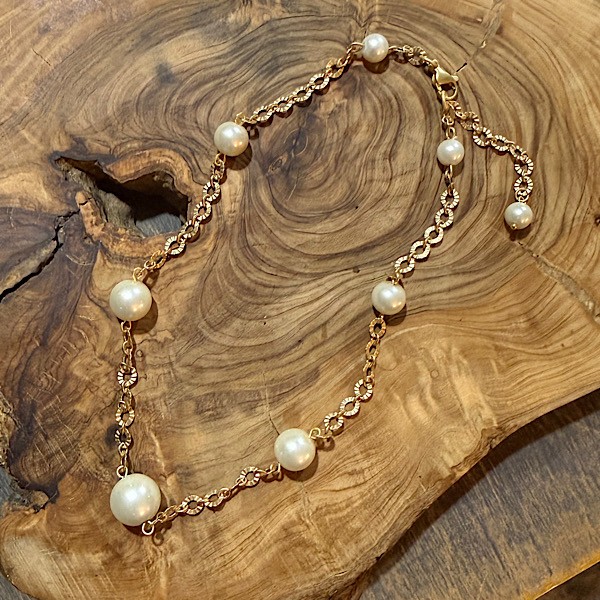 Glass pearls in graduated sizes on matte gold chain.  Approx 16