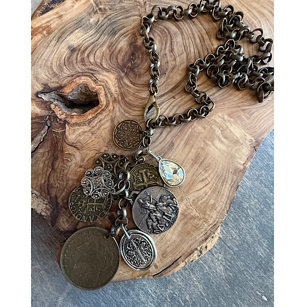 1Multi-medallion lariat style necklace of mixed metals on antique bronze chain