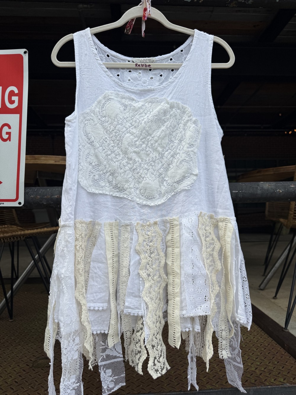 Shirt: Sleeveless white linen w/ lace accent and fringe
