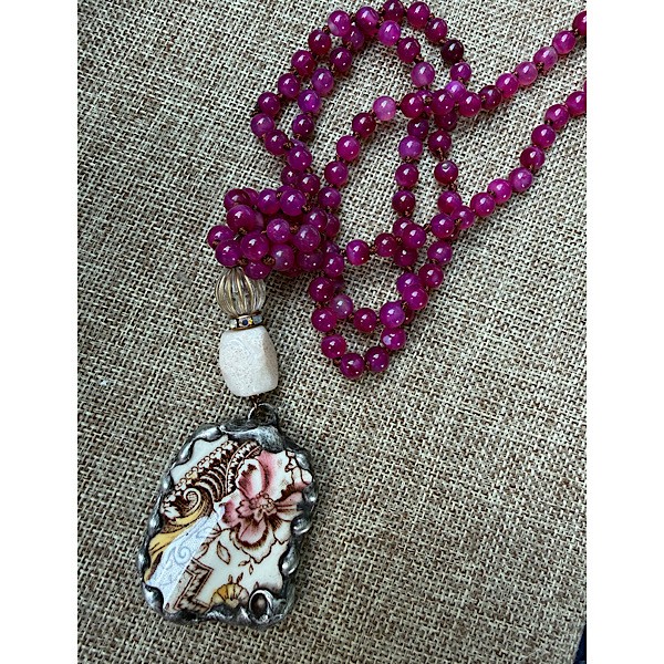 Broken china soldered pendant in vintage floral/white  w/ fossil stone & czech glass topper on long knotted Fucshia agate bead strand