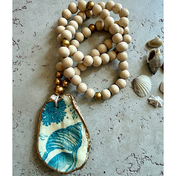 Oyster shell in decoupaged shell motif on long wood bead strand