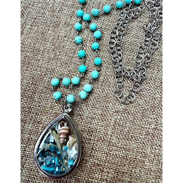 Memory pendant in silvertone w/shell & glass pearl collection on long ant. silver chain of turq howlite linked beads