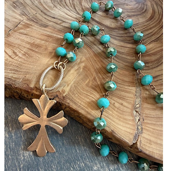 Cross in matte gold on short faceted aqua glass crystal linked chain