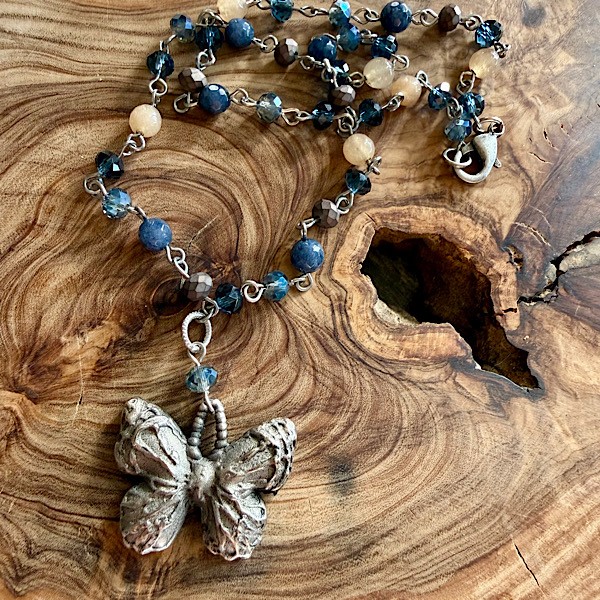 Butterfly in pewter on short linked chain of mixed stone and crystal