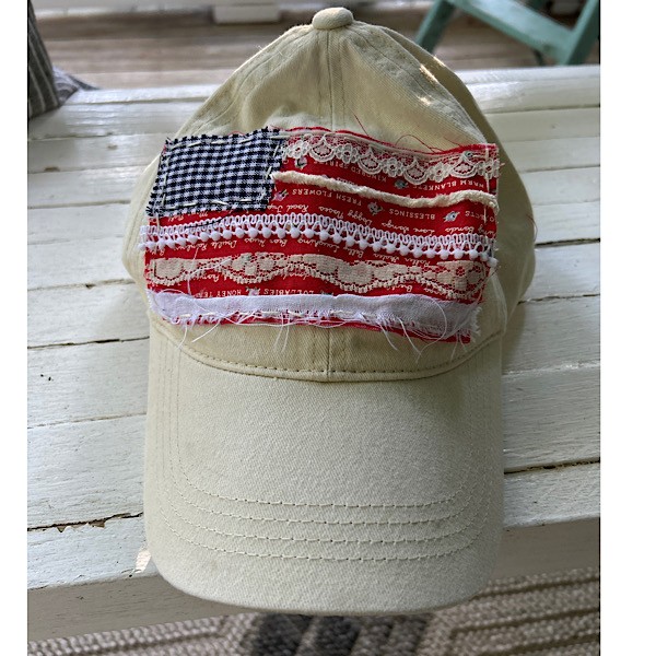 Hat:  Cream with rag flag embellishment