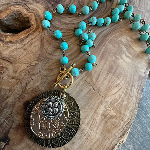 1Layered mixed metal medallions w/toggle on short chain of linked turquoise howlite